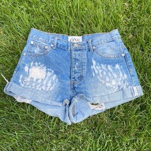 Relaxed fit distressed denim shorts
